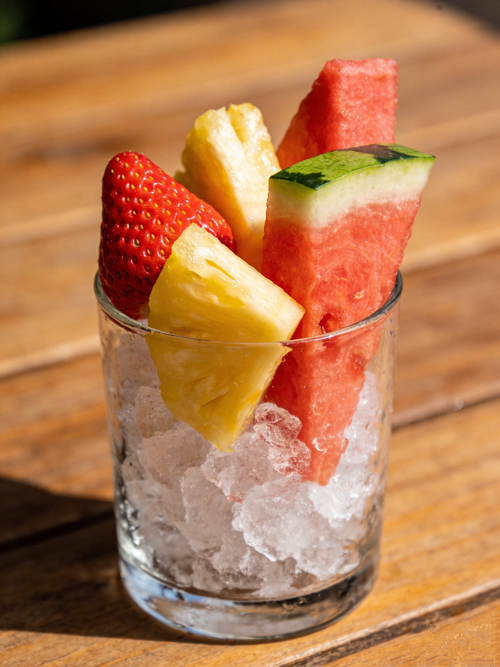 Free Refreshing mix of watermelon, pineapple, and strawberry on ice. Stock Photo