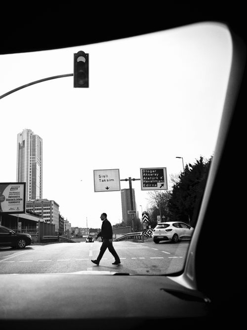 Free Candid street photo of a man crossing in central İstanbul, showcasing urban daily life. Stock Photo
