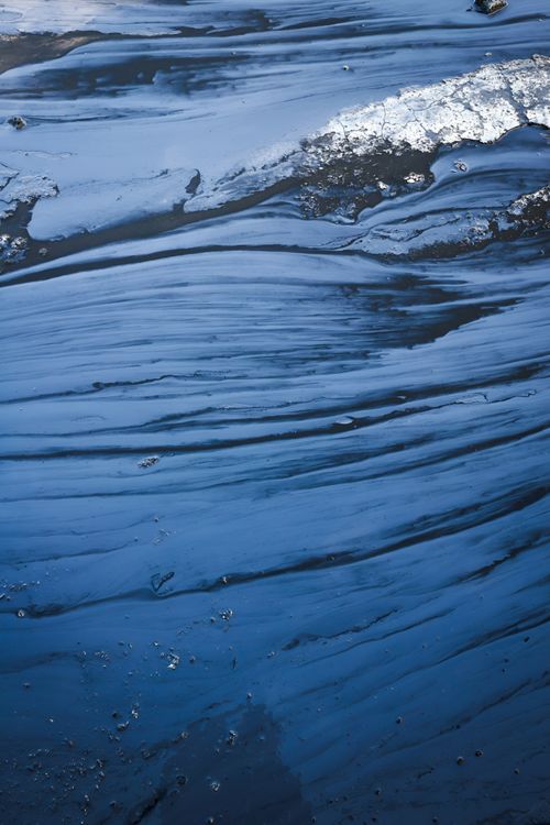 Free Aerial shot capturing the textured and serene surface of deep blue water. Stock Photo