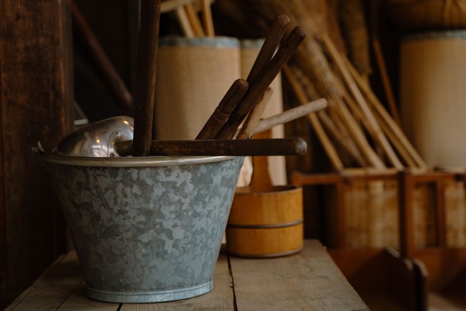 A collection of traditional Japanese tools in a rustic workshop setting in Tokyo.