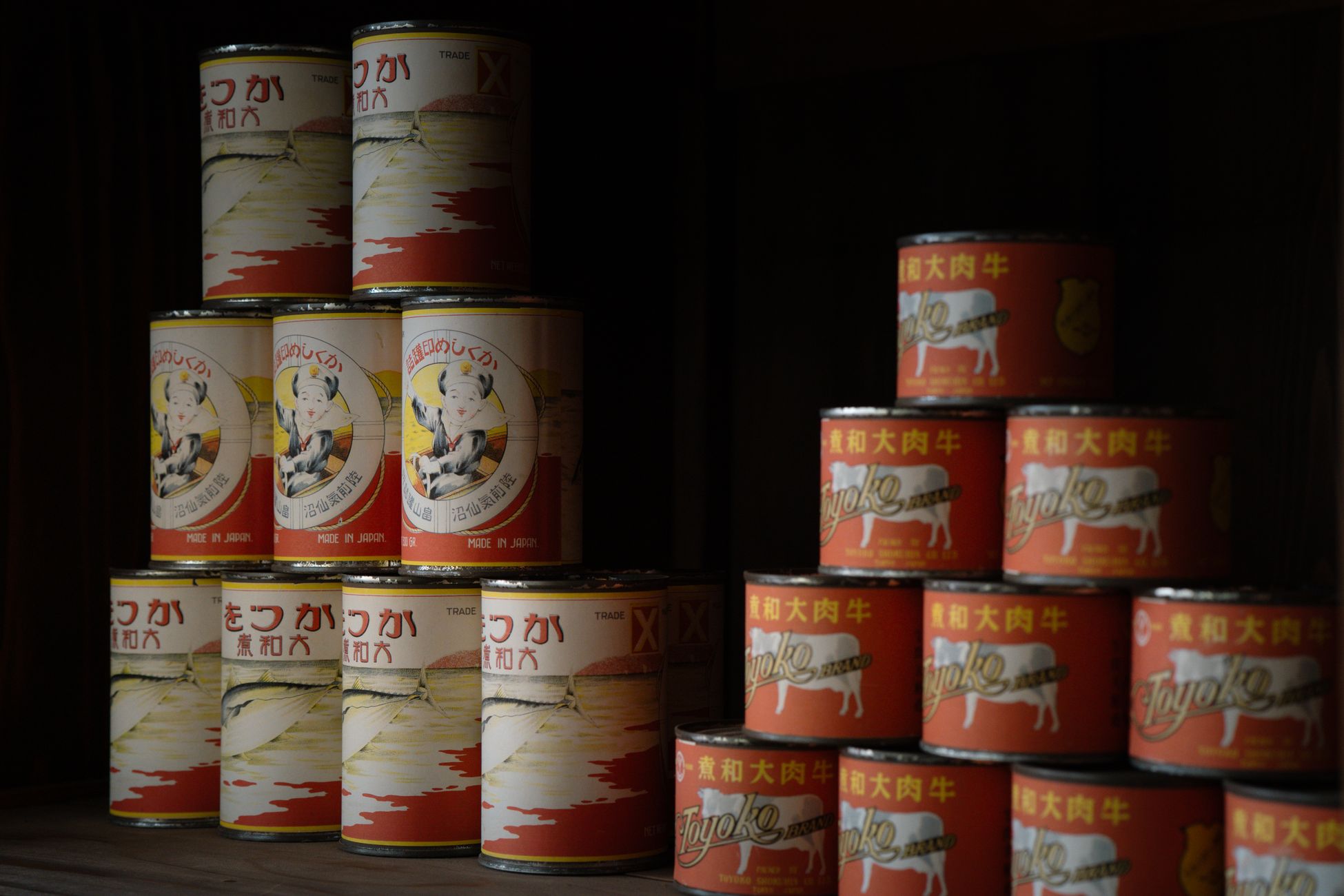Old-style canned food stacked neatly, showcasing traditional Japanese packaging in Tokyo.