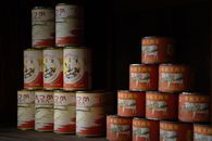 Old-style canned food stacked neatly, showcasing traditional Japanese packaging in Tokyo.