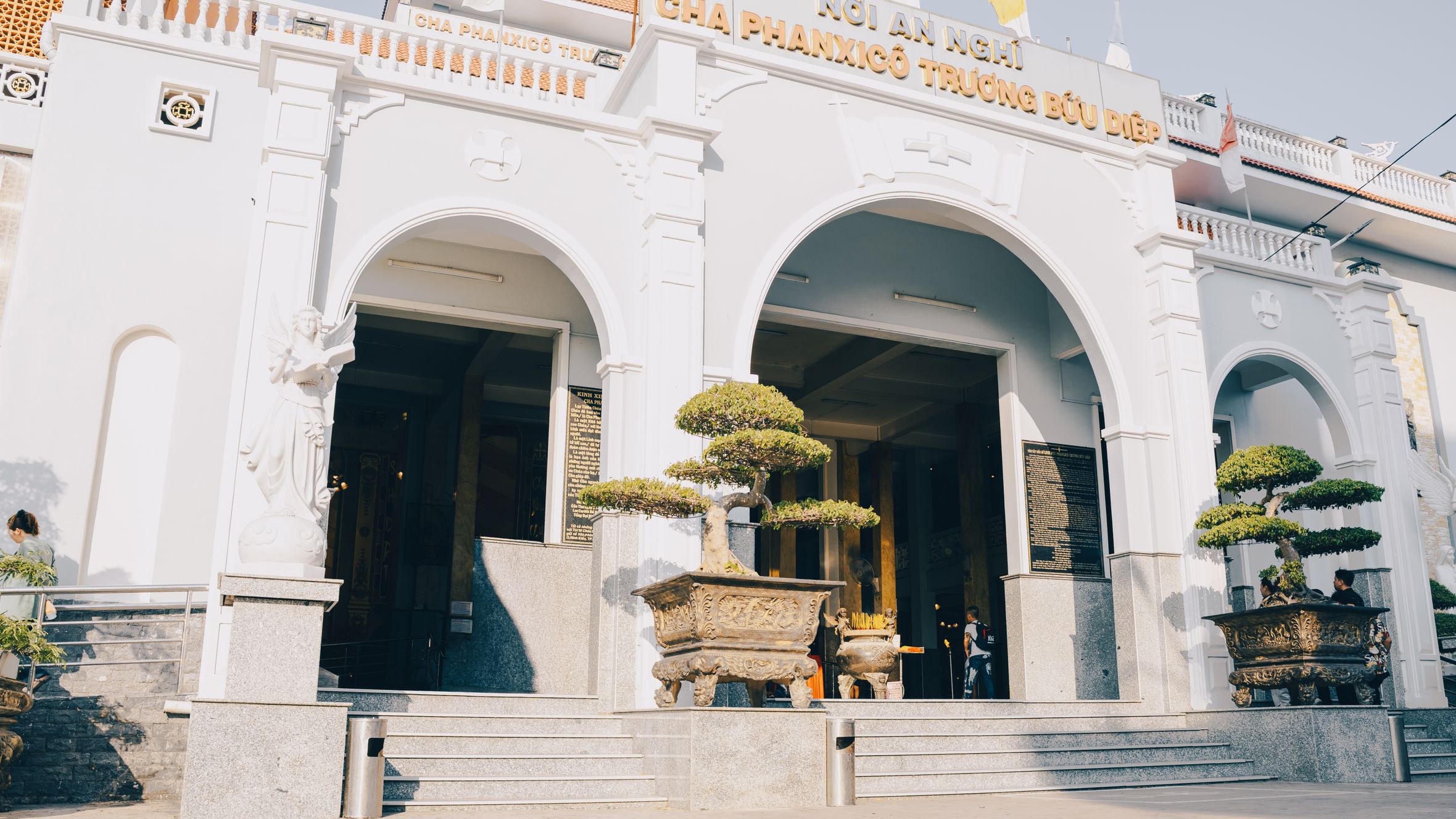 The grand entrance of Cha Phanxico Truong Buu Diep in sunlight, Cà Mau, Vietnam.