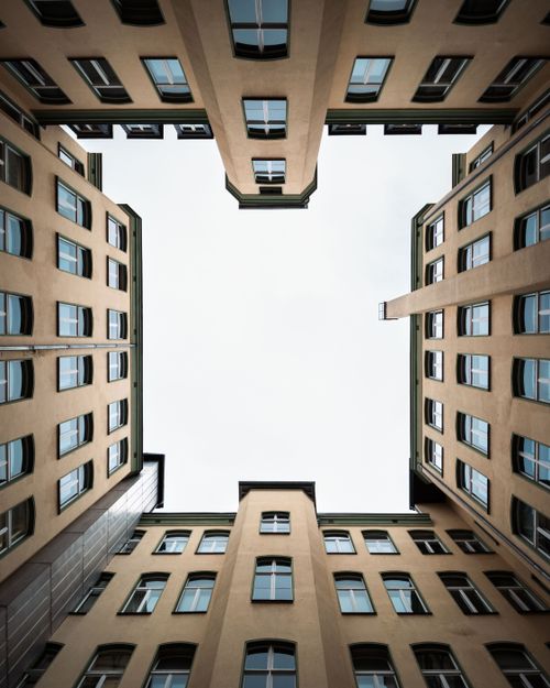 Free Looking up at symmetrical buildings in Berlin with clear sky above. Stock Photo