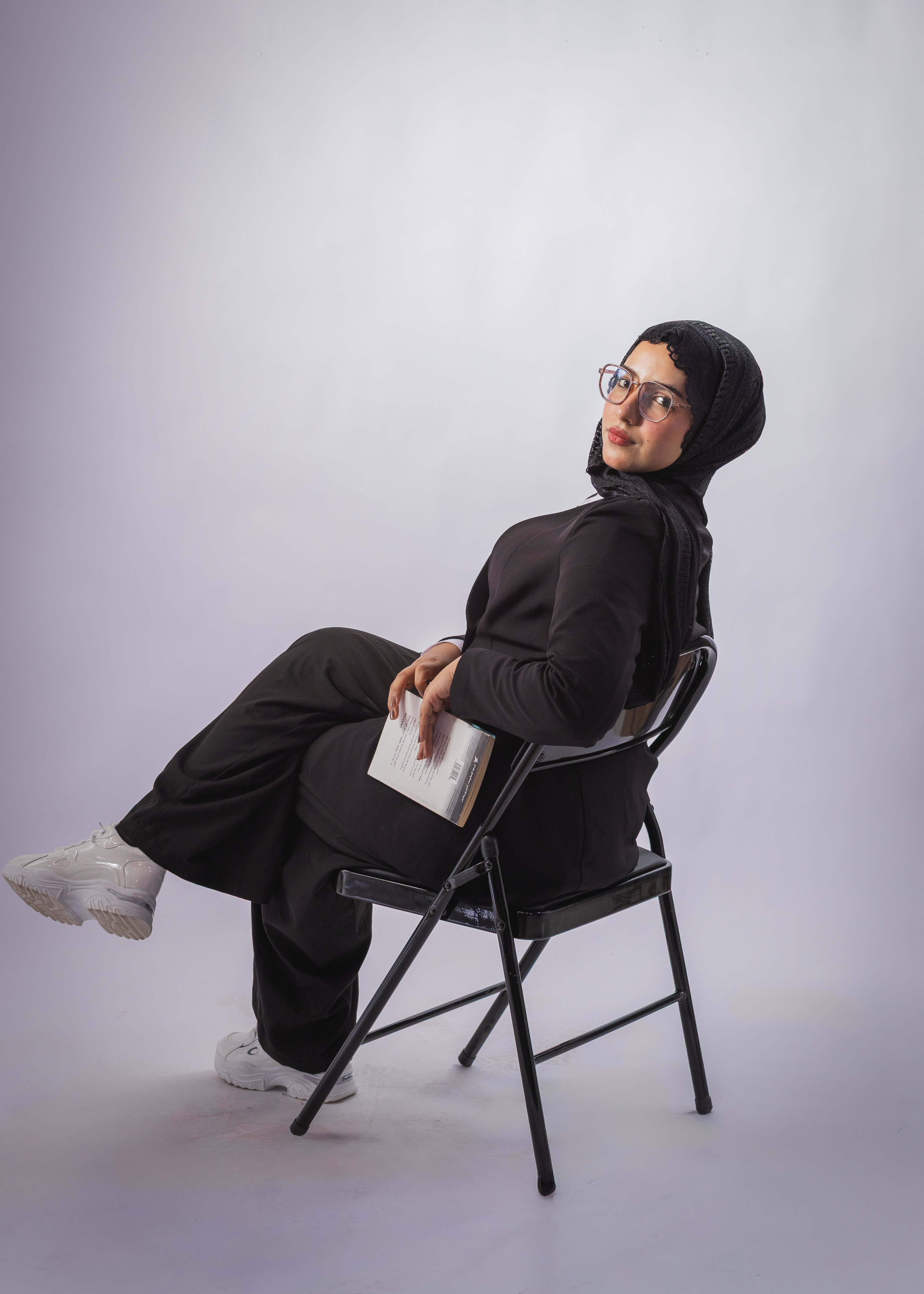 A Woman in Hijab Sitting on the Chair · Free Stock Photo