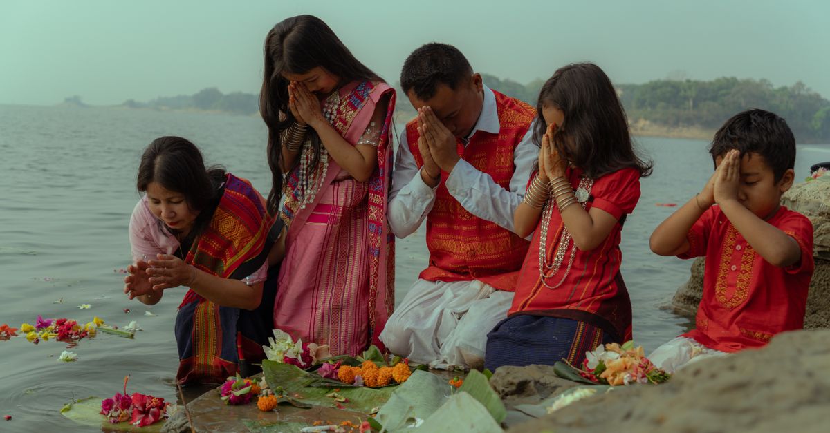 Children Engaging In Ritual Family Performing Ritual by Riverside · Free Stock Photo