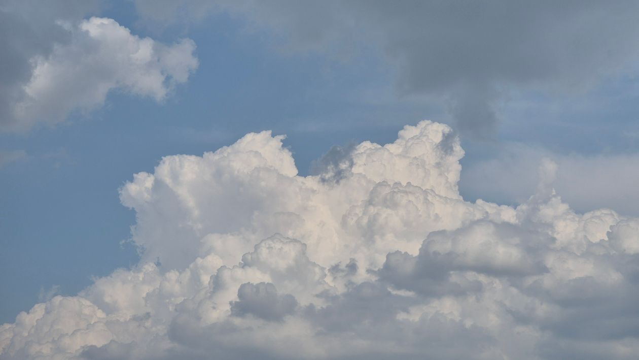 Dramatic Cumulus Clouds in Clear Blue Sky · Free Stock Photo