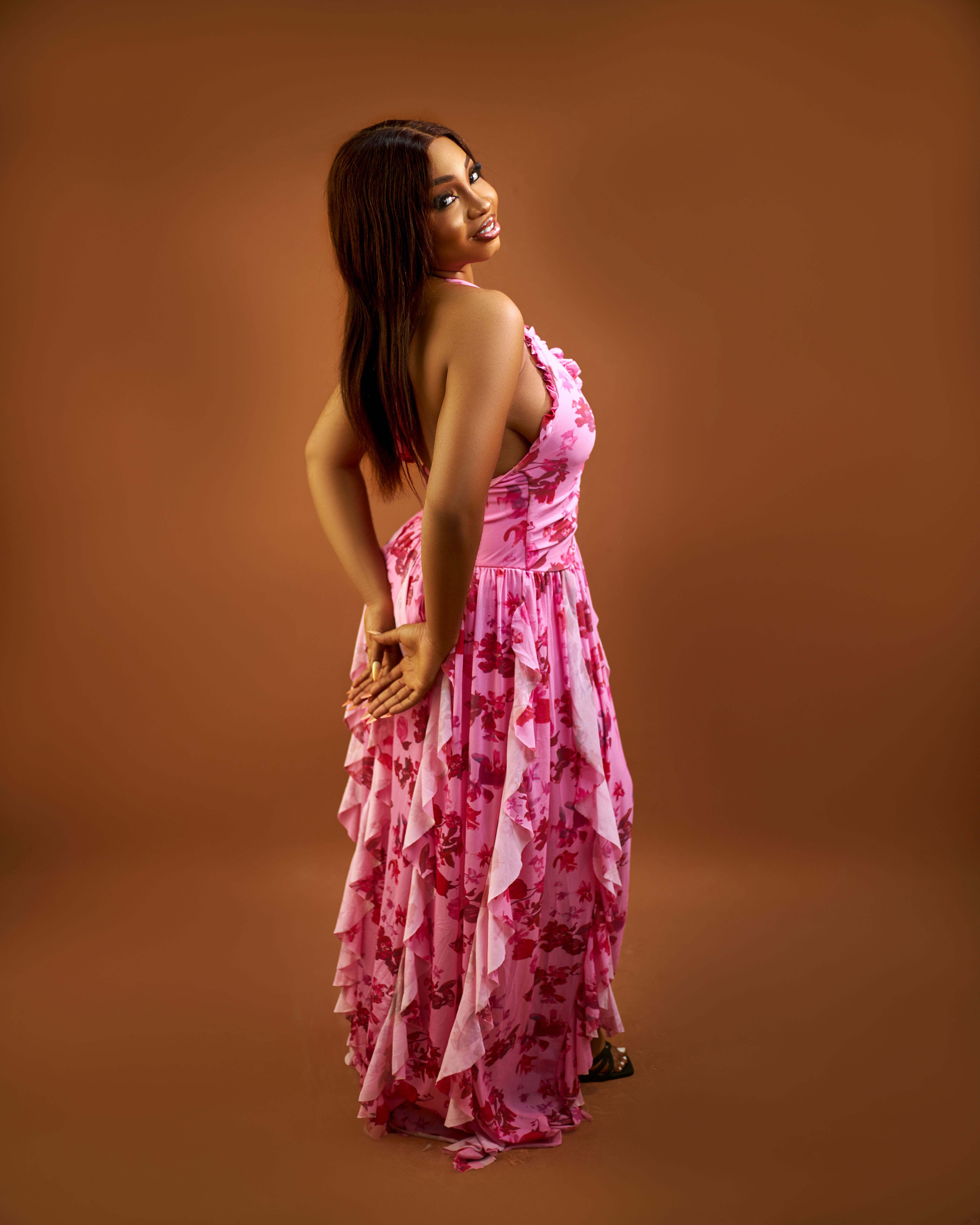 Portrait of a Smiling Woman in Pink Dress · Free Stock Photo