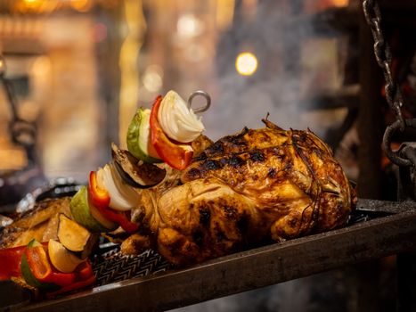 Succulent grilled chicken with colorful vegetable skewer, perfect for BBQ lovers.
