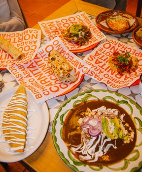 A vibrant display of diverse Mexican dishes in San Pedro Cholula's local eatery, Puebla, Mexico.