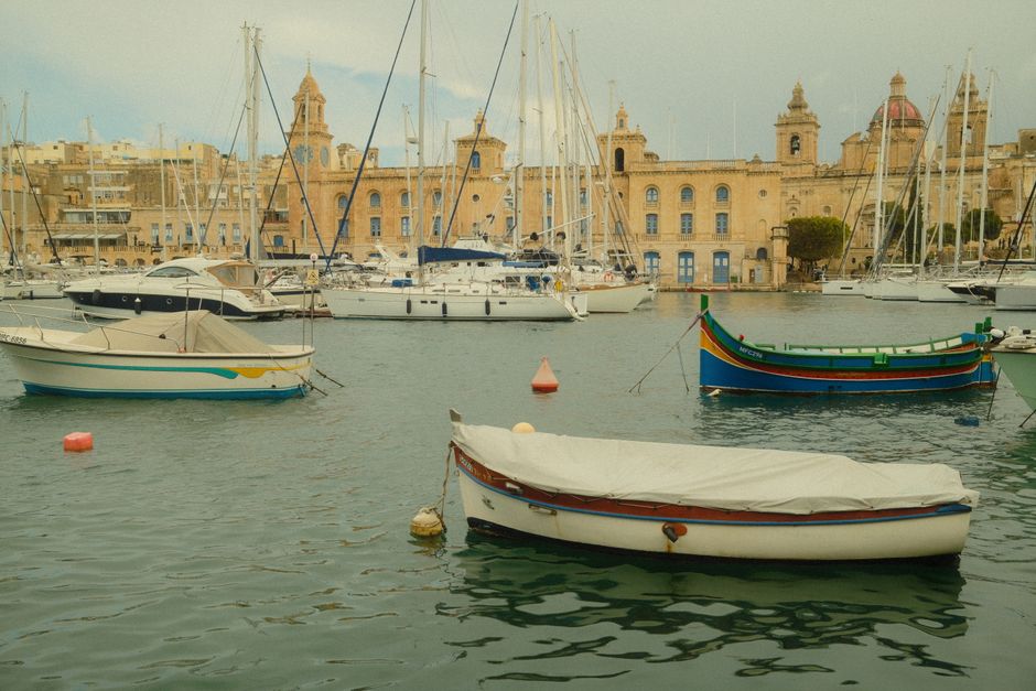 Incredible Private Day Trip on Modern Catamaran Malta Gozo and Comino Review: The Ultimate Maltese Islands Experience Review 2026 - Picturesque harbor in Malta featuring traditional boats and historic architecture.