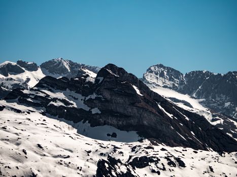 Snow-capped peaks of Vorderthal in Schwyz, Switzerland, showcasing breathtaking alpine scenery.