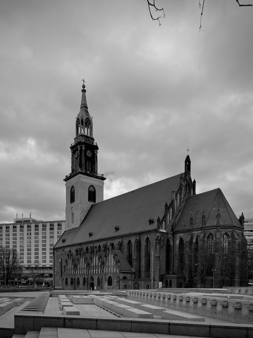 Free Black and white photo of St. Mary's Church in Berlin, showcasing Gothic architecture under cloudy skies. Stock Photo