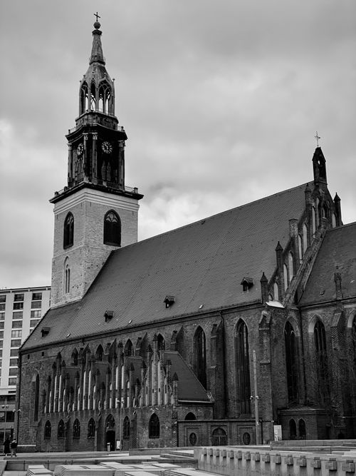 Free Black and white photo of St. Mary's Church in Berlin, showcasing Gothic architecture under cloudy skies. Stock Photo