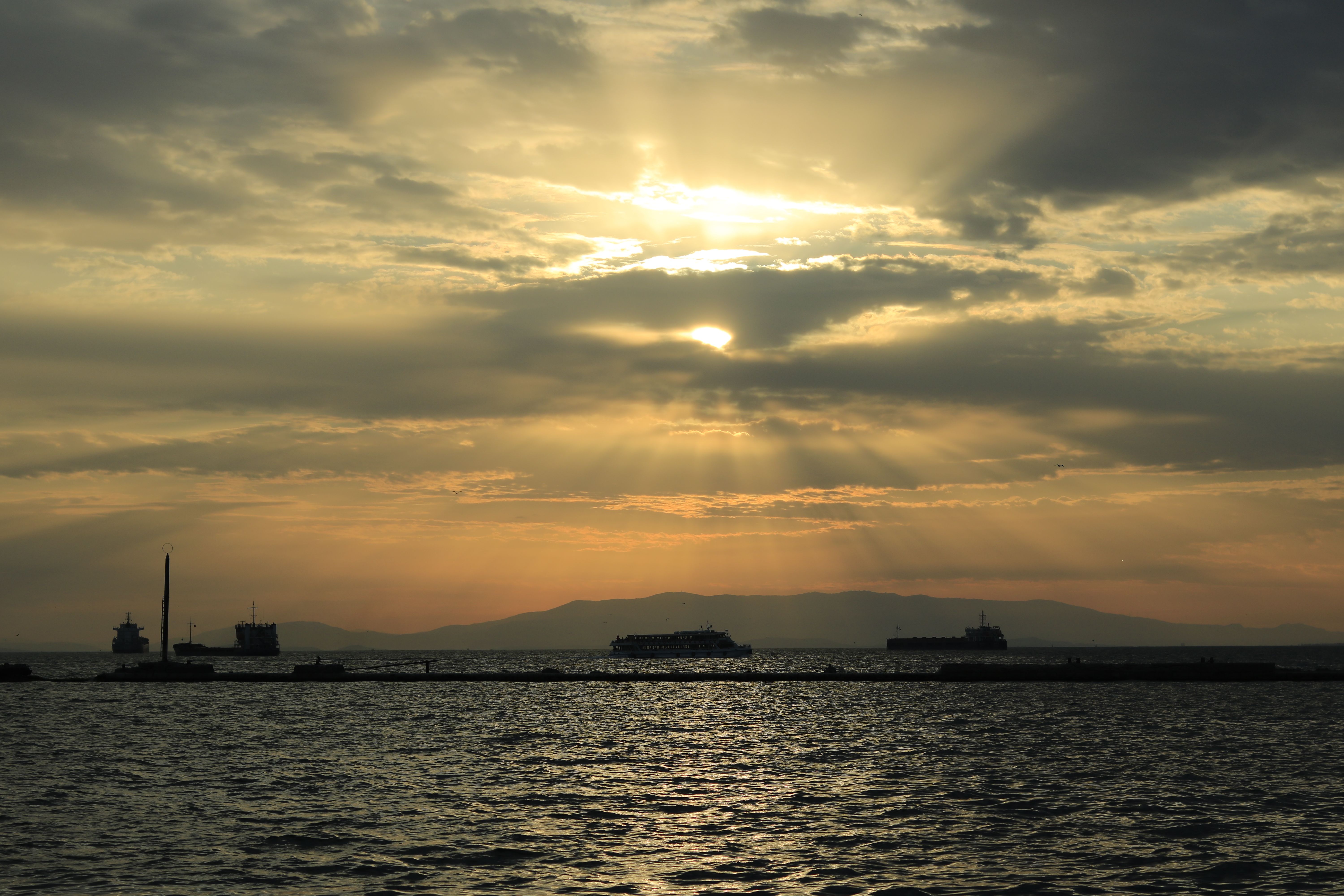 Sunset over İzmir Bay with Silhouetted Ships · Free Stock Photo