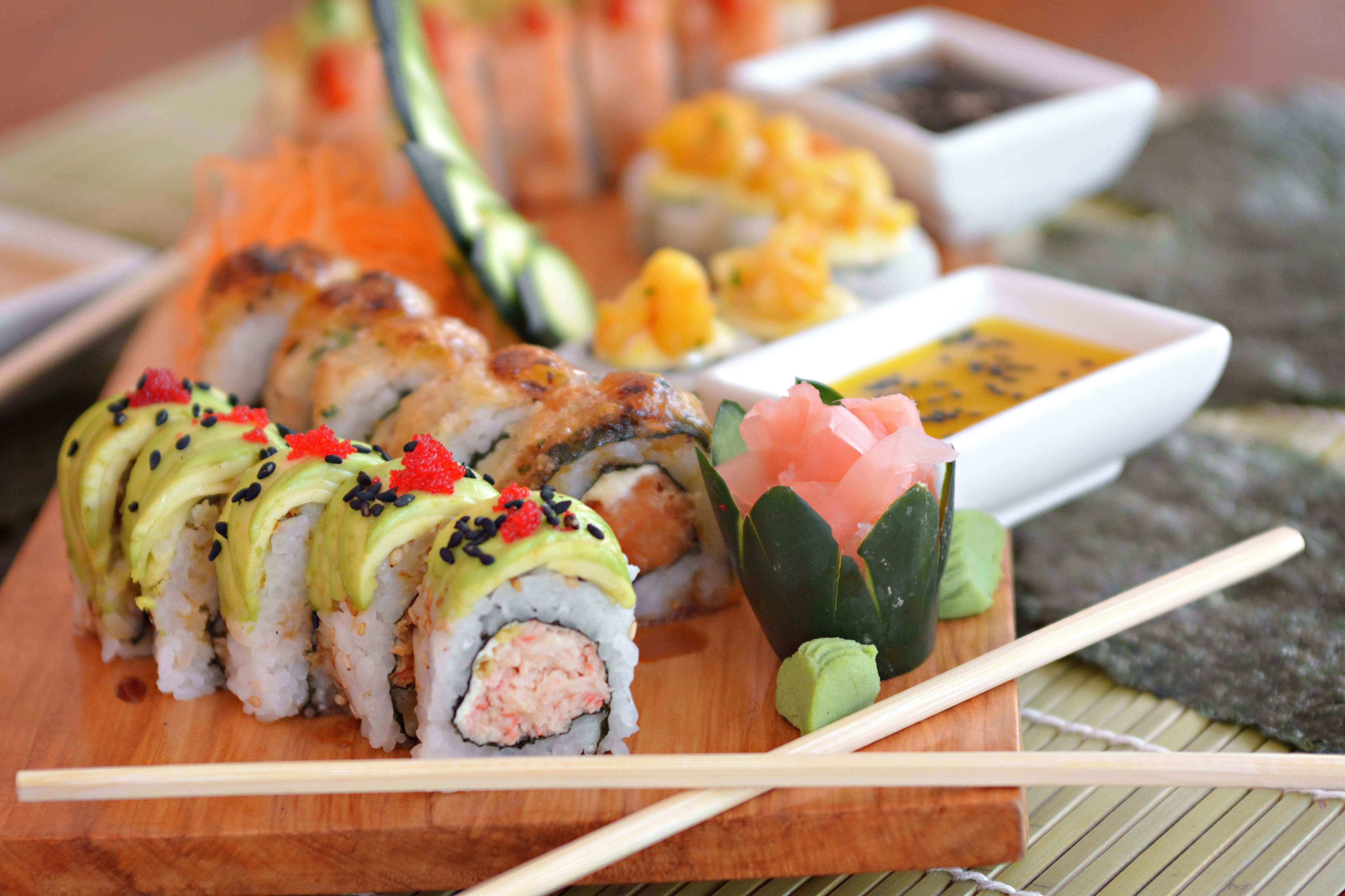 colorful vegan sushi platter with avocado and carrots - vegan rice recipes