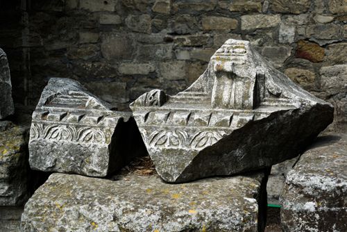 Free Detailed view of ancient stone carvings showcasing intricate patterns in historic ruins. Stock Photo