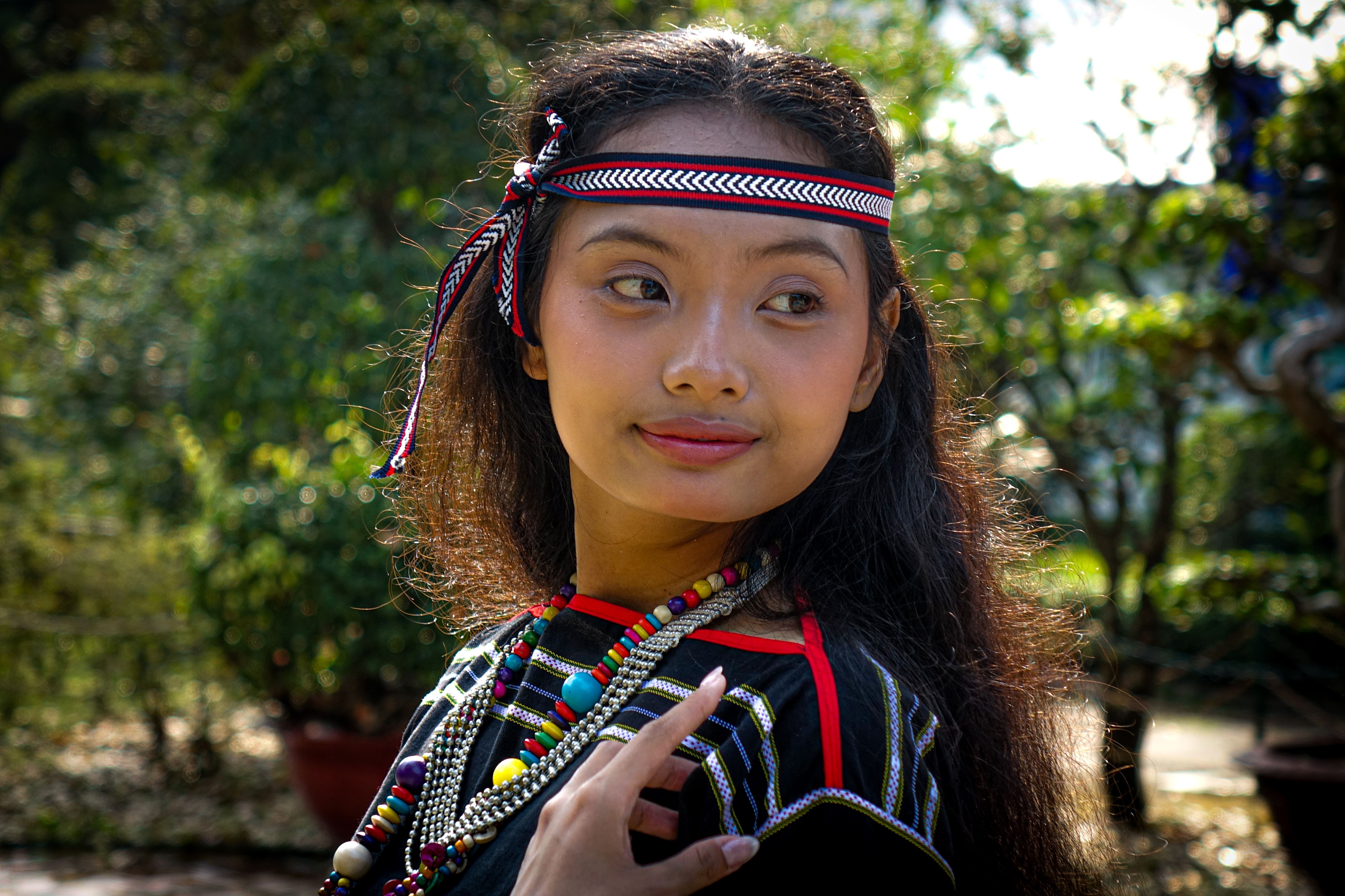 Young Girl in Traditional Attire Outdoors · Free Stock Photo