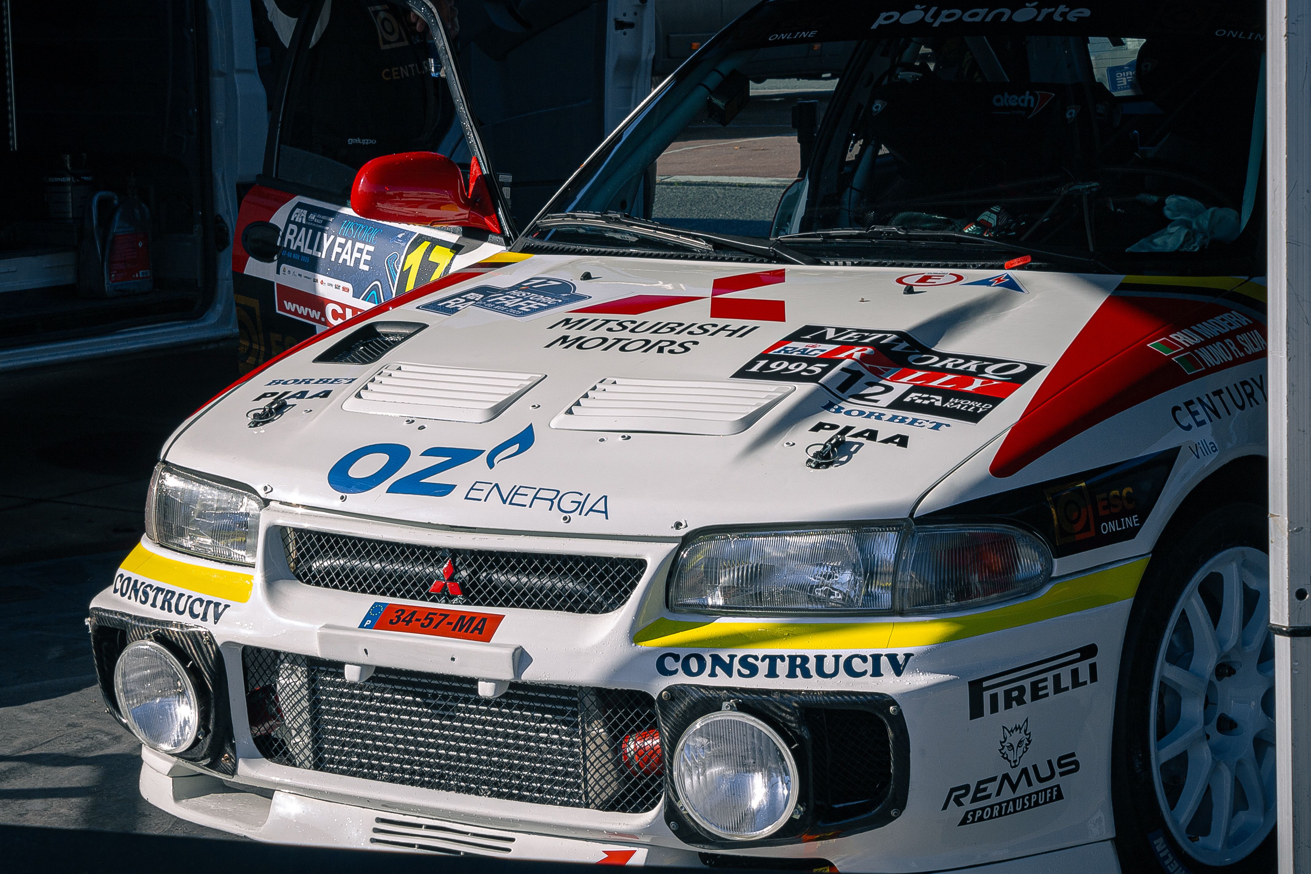 Close-Up of Rally Car with Sponsor Logos · Free Stock Photo