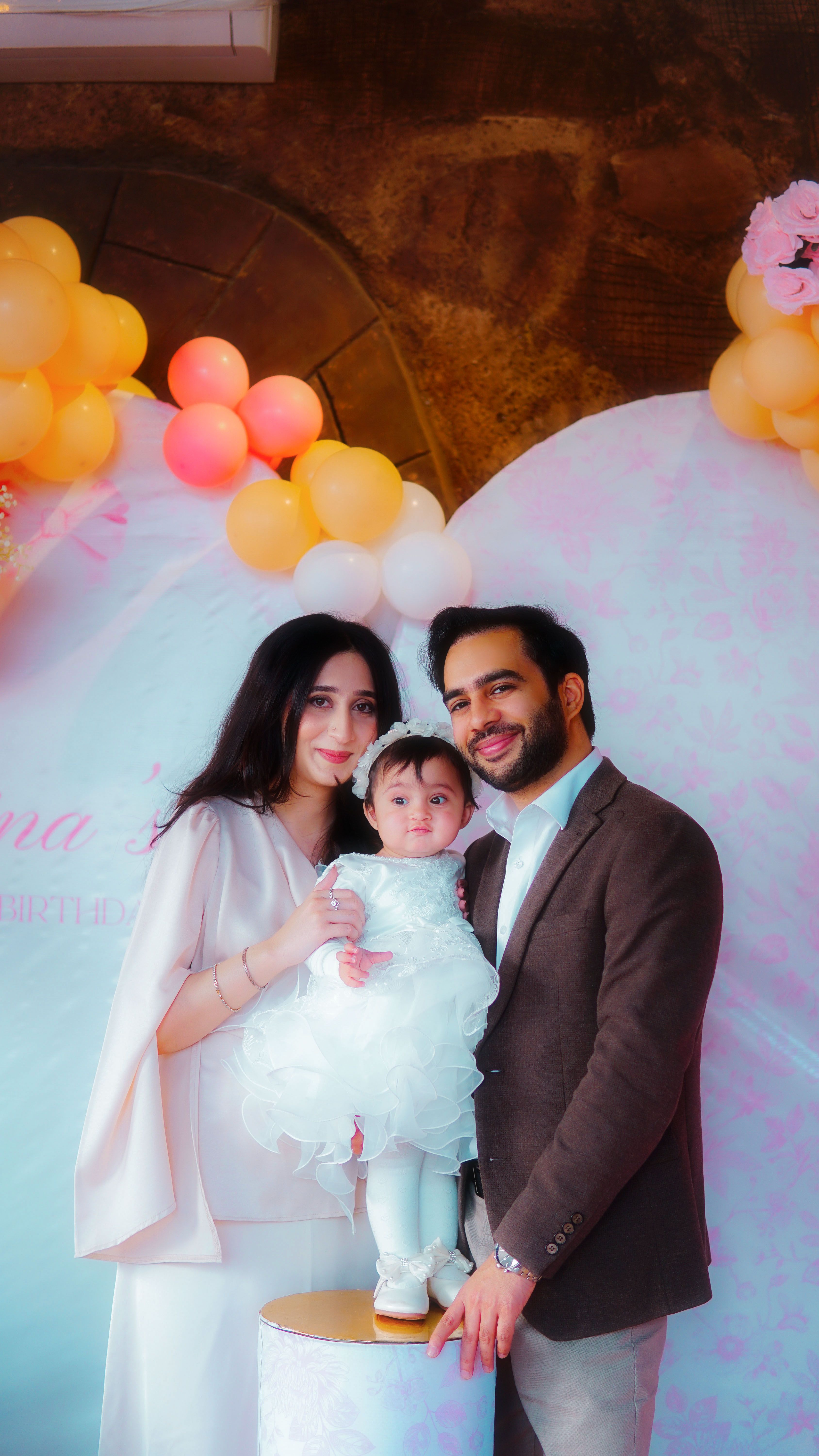 Happy family celebrating with balloons and joyful smiles. Perfect moment of love and togetherness.