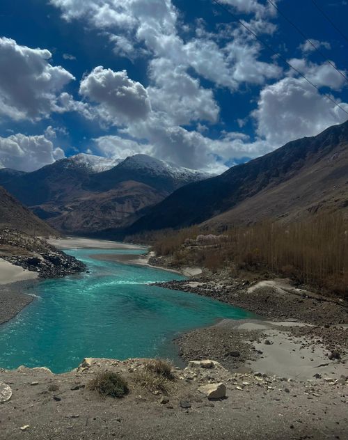 Free Breathtaking view of turquoise river flowing through Skardu Valley in Pakistan, framed by majestic mountains. Stock Photo