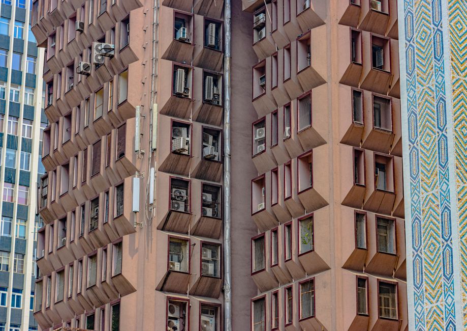 Symmetrical architecture with modern design and air conditioning units in New Delhi, India.