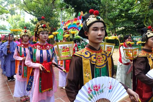 Free A colorful procession showcasing traditional attire and cultural celebration outdoors. Stock Photo