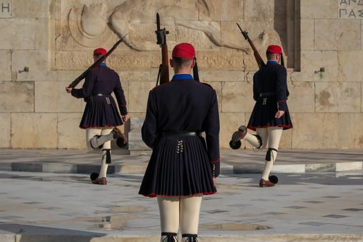 Evzones ceremonial guards in traditional attire during the changing of the guard in Athens.