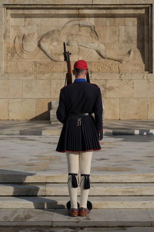 Free Evzone guard in traditional attire at Athens' Tomb of the Unknown Soldier. Stock Photo