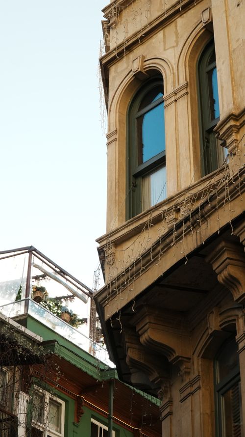 Free Ornate historic building facade with arched windows in İstanbul, Türkiye showcasing classic architecture. Stock Photo