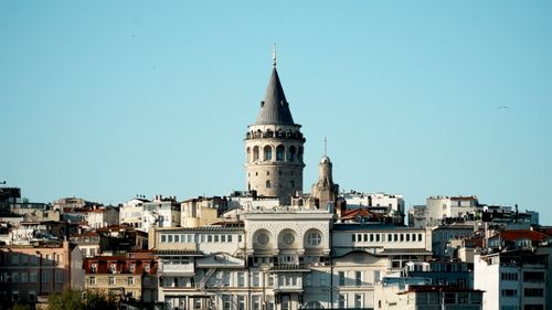 Free A stunning view of the historic Galata Tower amidst Istanbul's cityscape under a clear blue sky. Stock Photo