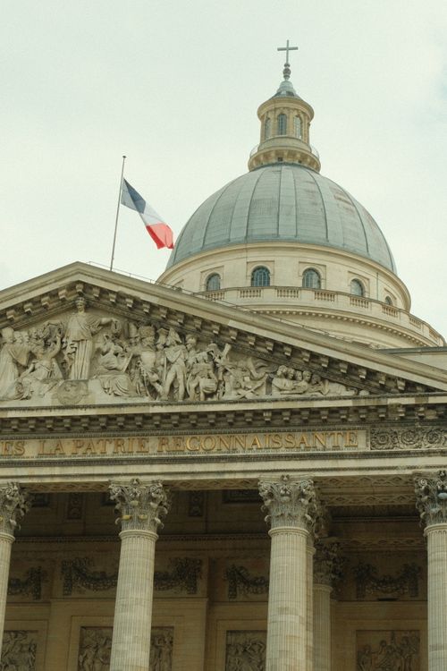 Free Striking architectural details of the Pantheon dome with French flag, Paris landmark. Stock Photo