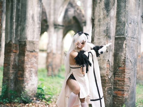 A captivating cosplay photoshoot in historic ruins of Việt Nam, blending fantasy and tradition.