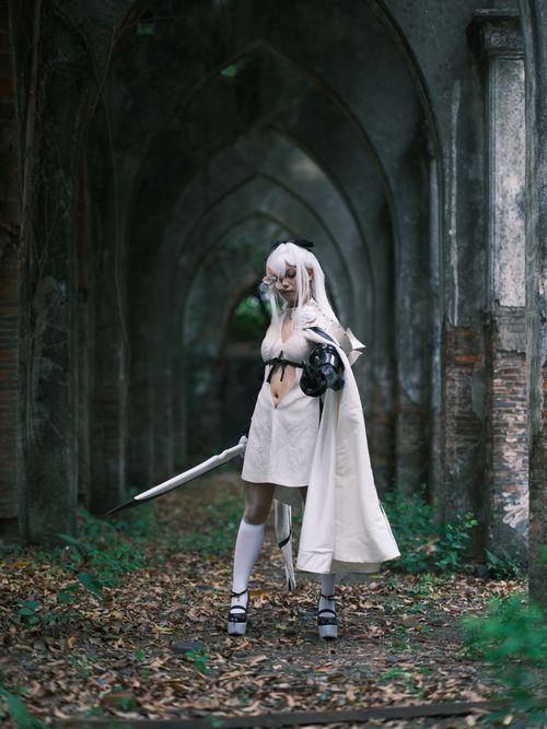 Free Captivating cosplay portrait in historic Vietnamese gothic architecture. Stock Photo