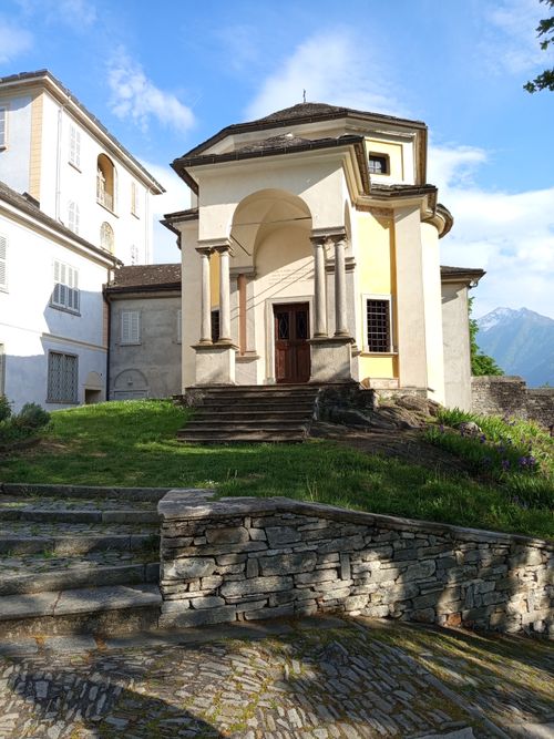 Free A charming historic chapel amidst scenic mountains, showcasing classic architecture. Stock Photo