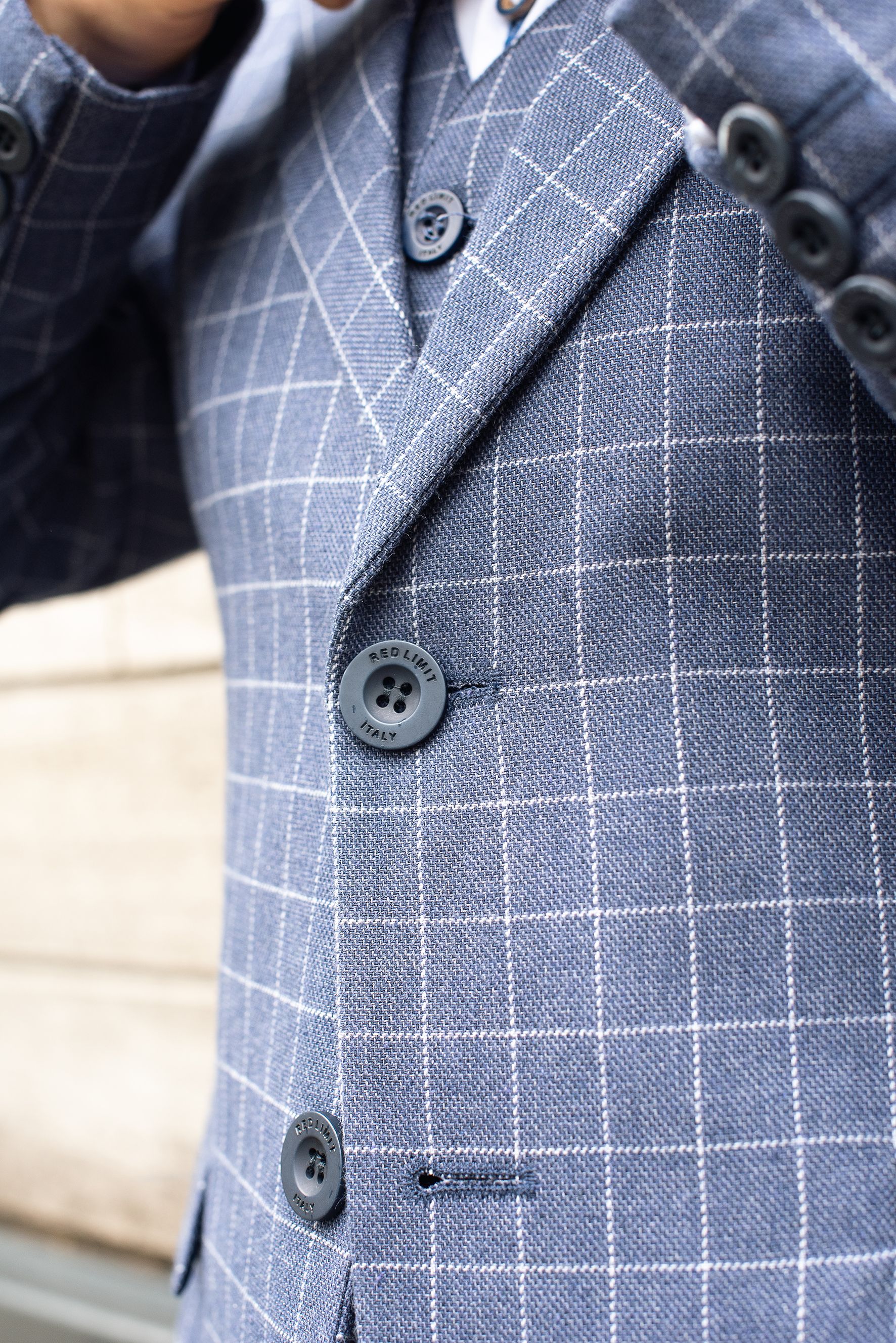Stylish blue checkered business suit jacket, ideal for professional attire.