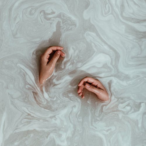 Free Person's Hands In The Water Stock Photo