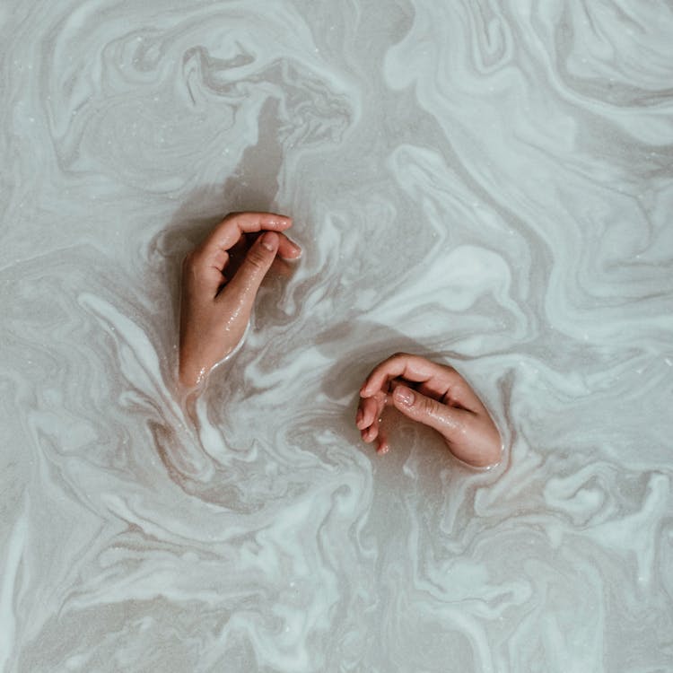 Free Person's Hands In The Water Stock Photo