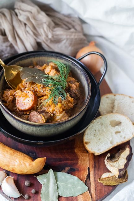 Sliced kielbasa braised with tangy sauerkraut, onion, and caraway, a simple one-pan Polish weeknight dinner.