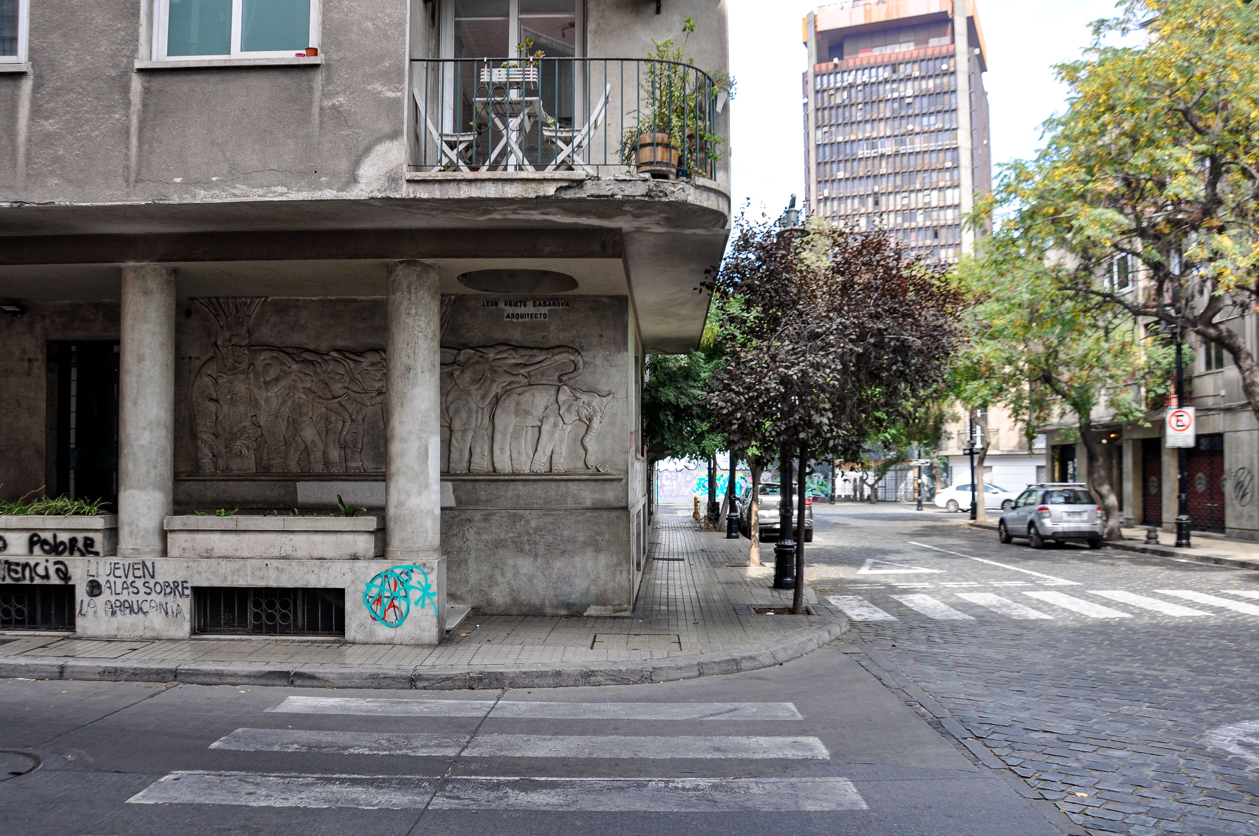 Street scene in Santiago, showcasing urban architecture and street art.