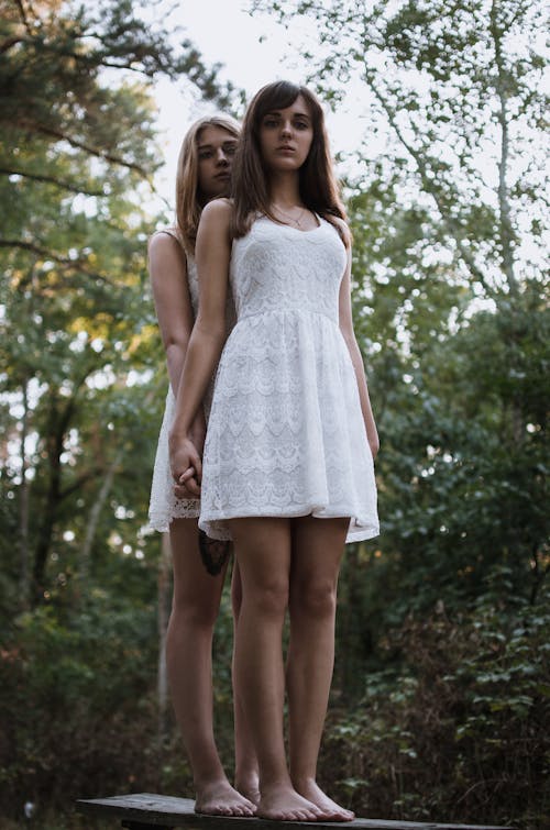 Women In White Dresses