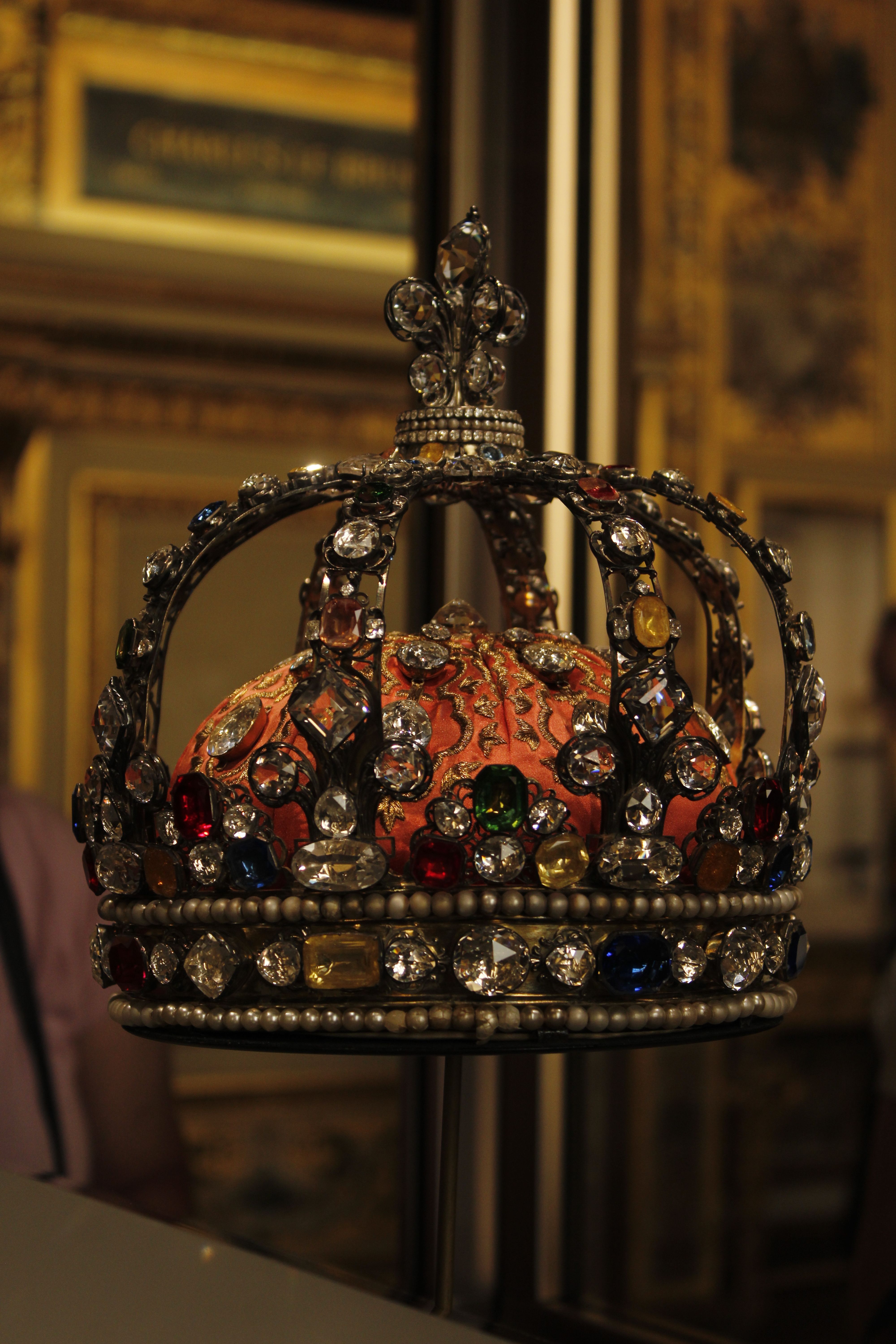Ornate Royal Crown with Jewels Displayed in Museum · Free Stock Photo