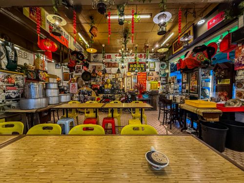 Free A vibrant interior of a Malaysian eatery adorned with cultural decorations and vivid colors in Kuala Lumpur. Stock Photo