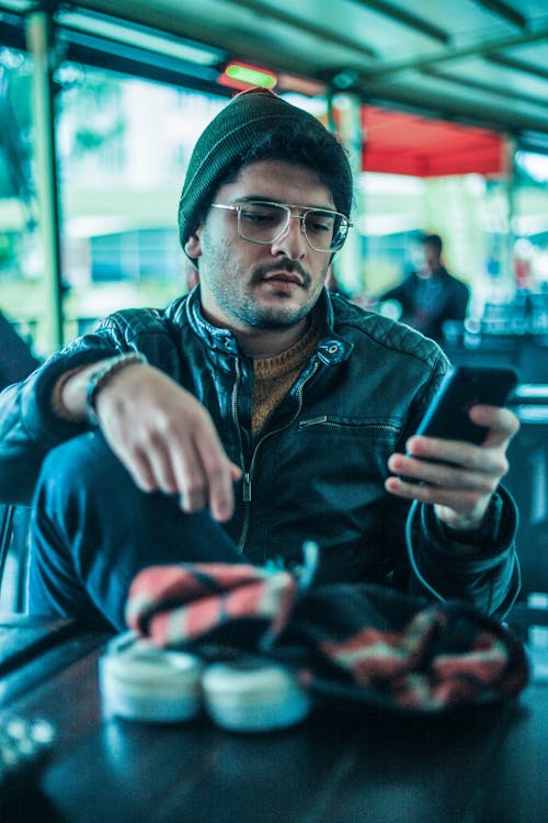 Man In Black Leather Jacket Wearing Eyeglasses