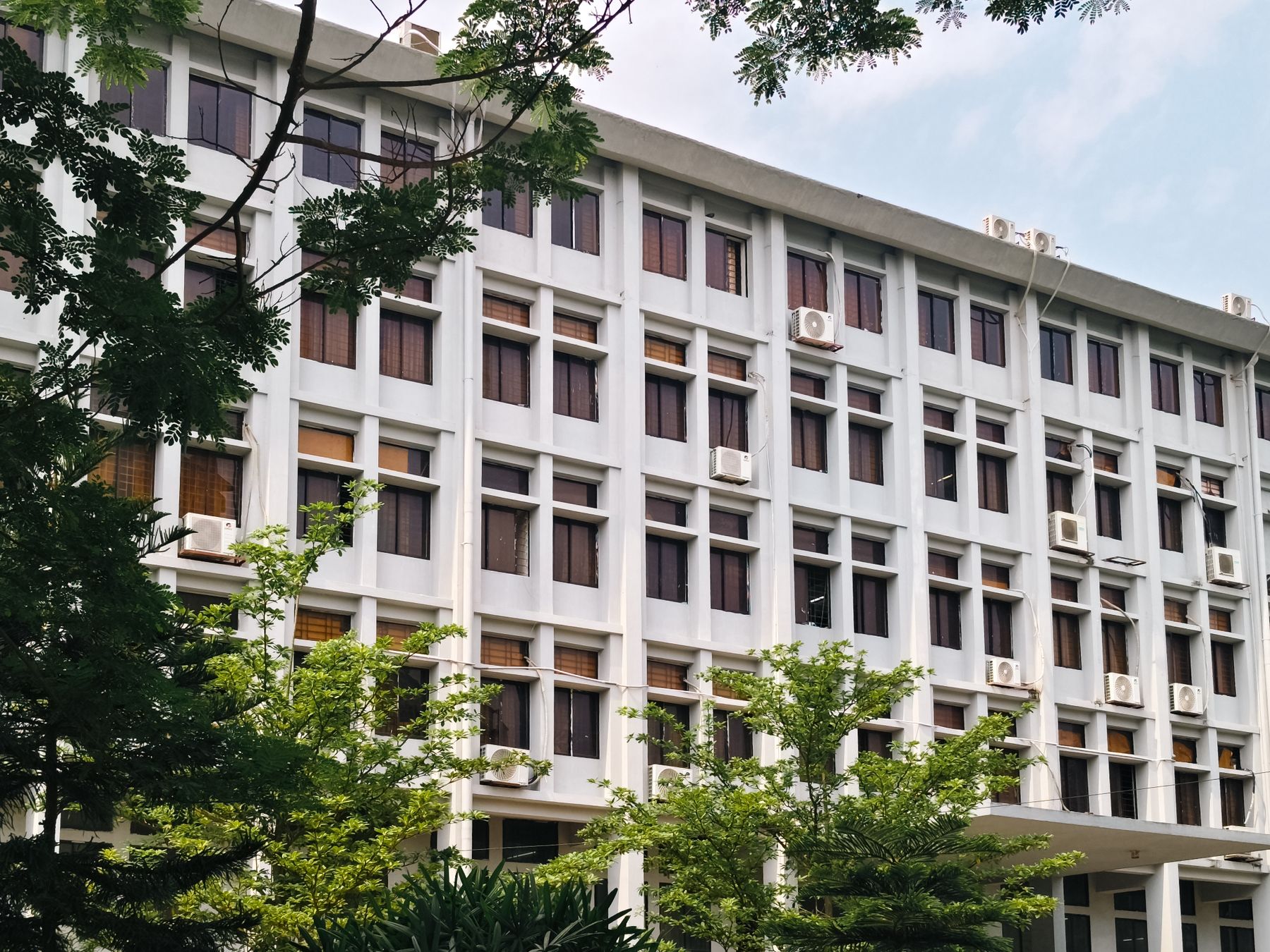 Modern commercial office building with visible air conditioning equipment