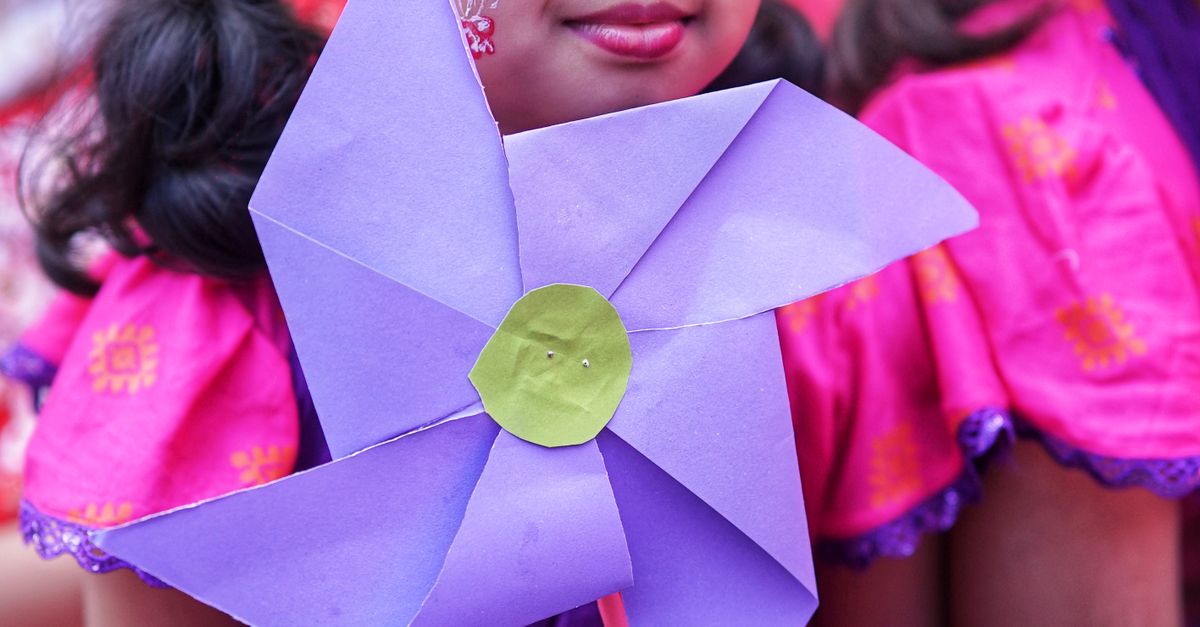 Pinwheel Purple Young Girl Holding Purple Pinwheel at Festival · Free Stock Photo