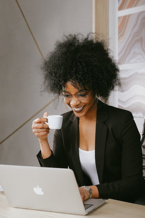 Woman In Black Blazer Holding White Ceramic Mug