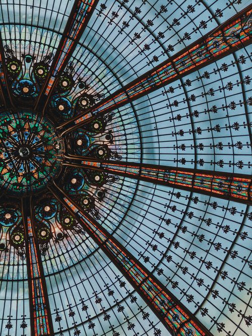 Free Intricate stained glass dome ceiling capturing Parisian elegance and artistry. Stock Photo