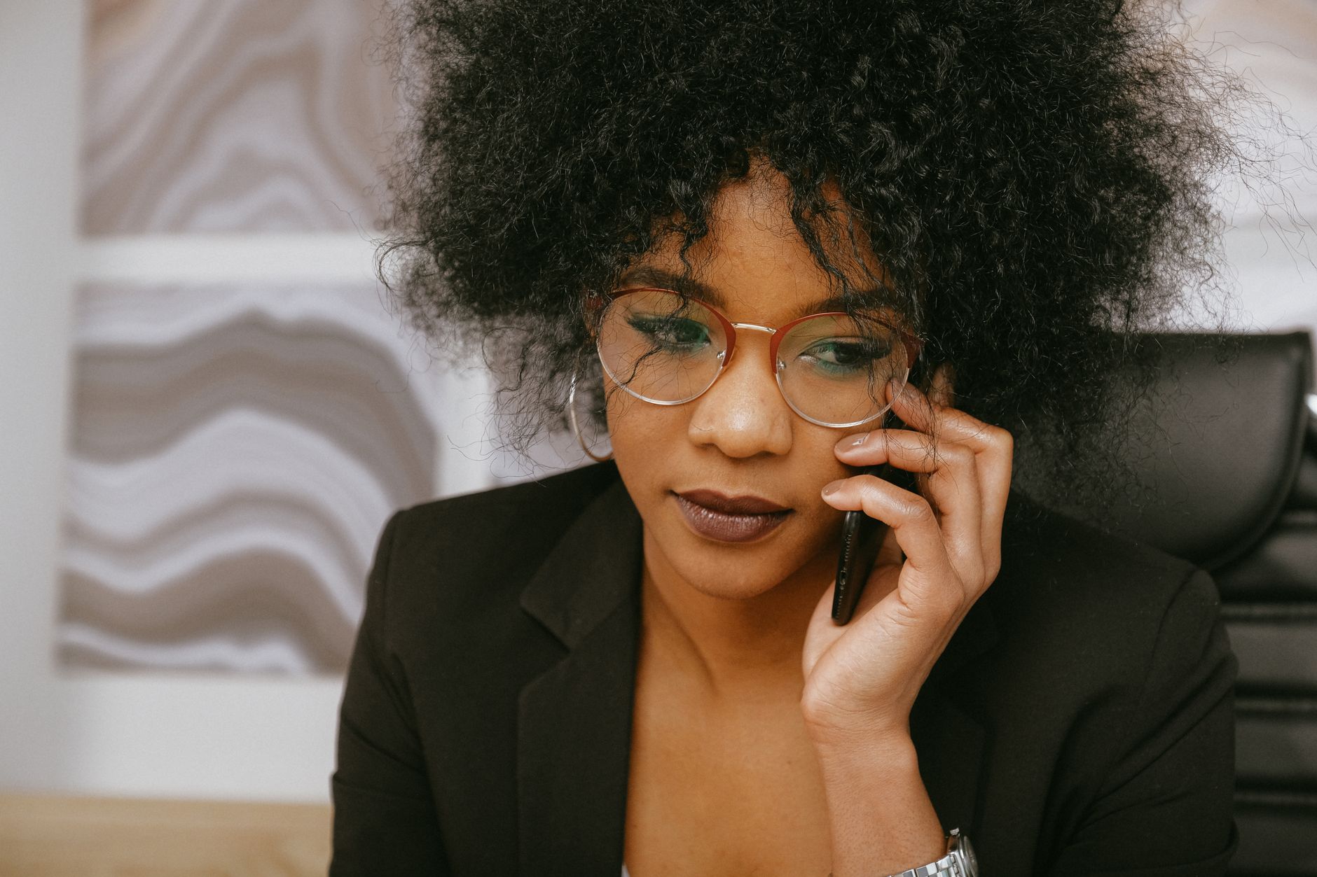 Woman In Black Blazer Talking On The Phone