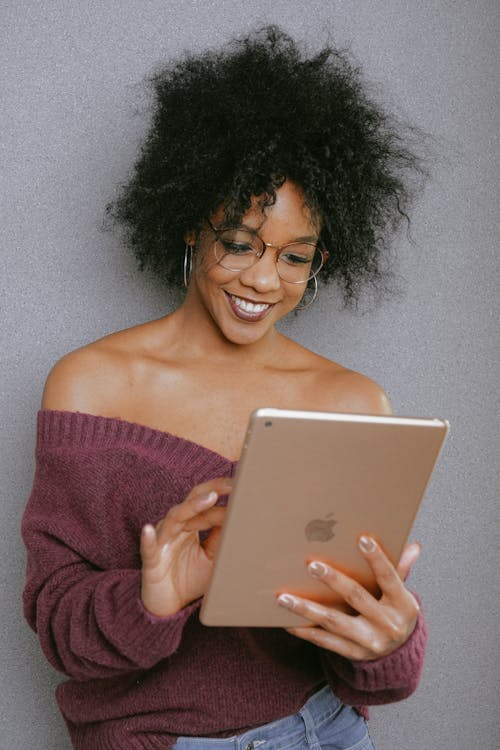 Free Woman In Purple Off Shoulder Top Holding An Ipad Stock Photo
